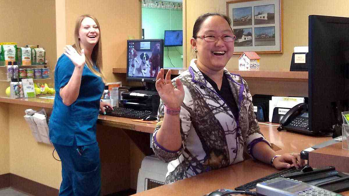 Receptionists waving